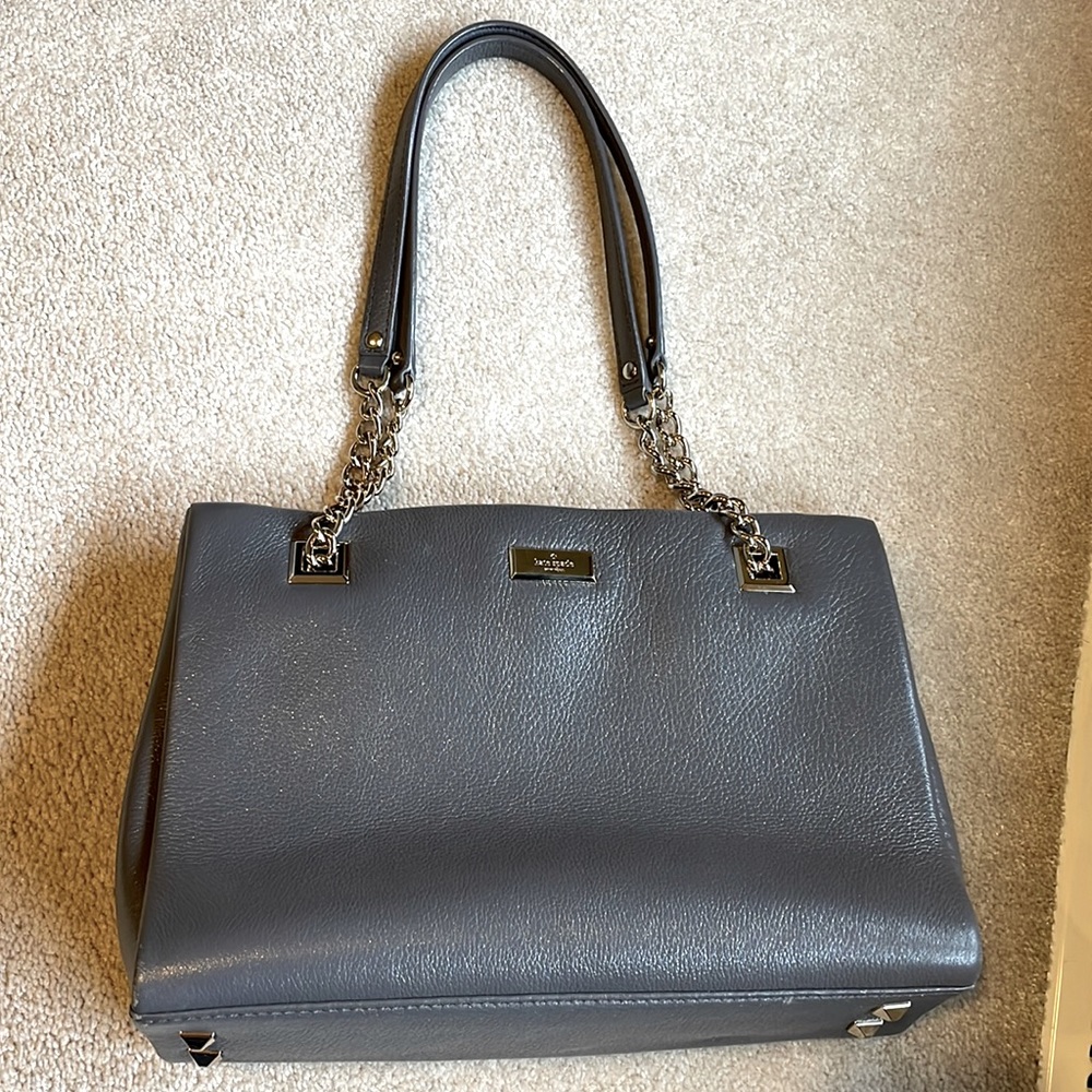 Grey leather Kate Spade handbag with gold chain shoulder straps.